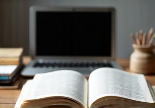 Open book and laptop